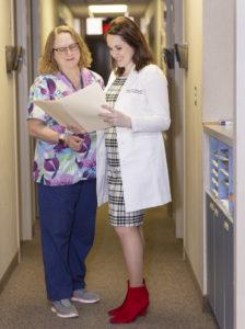 Dr. Amanda Sedlacek works with a team to provide palliative care.